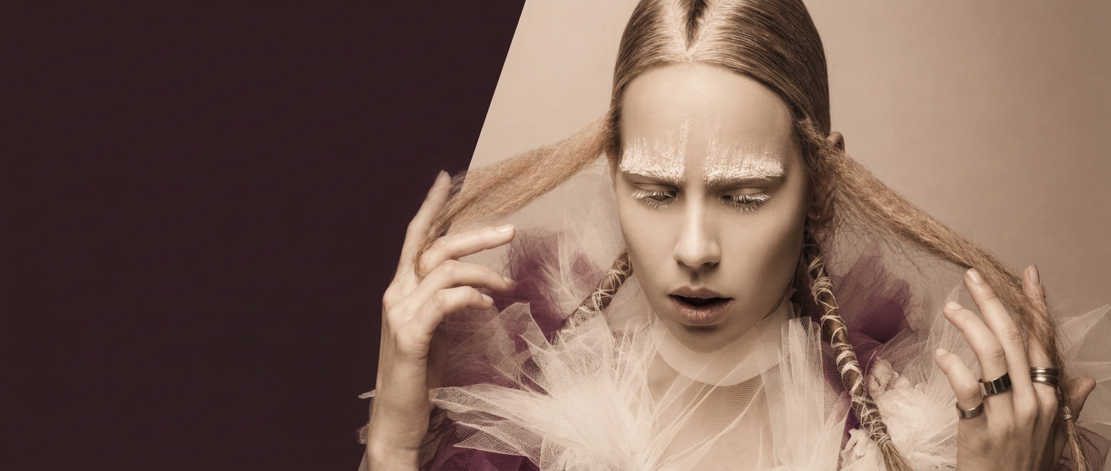 Editorial portrait on a deep plum panel